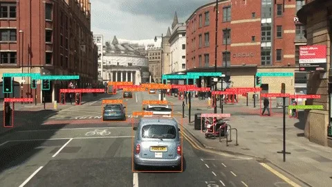 City street with vehicles tracked, each vehicle carrying a persistent track ID